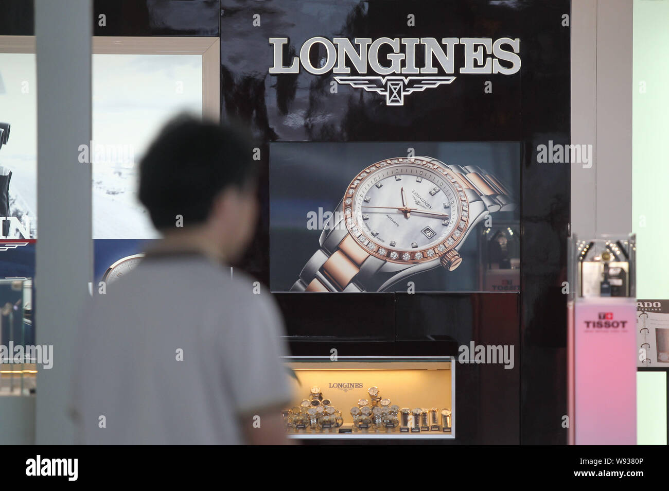 --FILE--A Chinese man enters a store of Luxury watch brand Longines at the Changsha Huanghua International Airport in Changsha, central Chins Hunan pr Stock Photo
