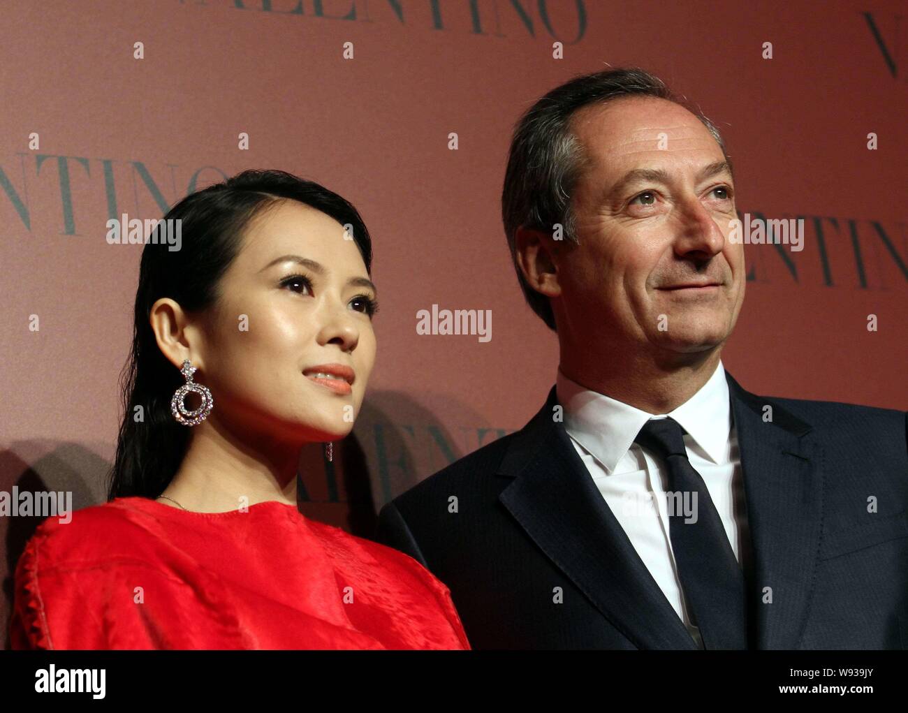 Brun Fremkald tryk Chinese actress Zhang Ziyi, left, poses with Stefano Sassi, CEO of Valentino  Fashion Group, as she arrives for the Valentino Shanghai Collection fashi  Stock Photo - Alamy