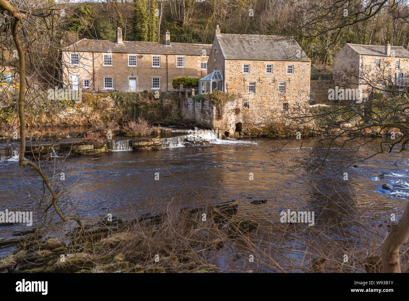 View over river Tee and houses on far bank at Barnard Castle a market town Teesdale, County Durham, England Stock Photo