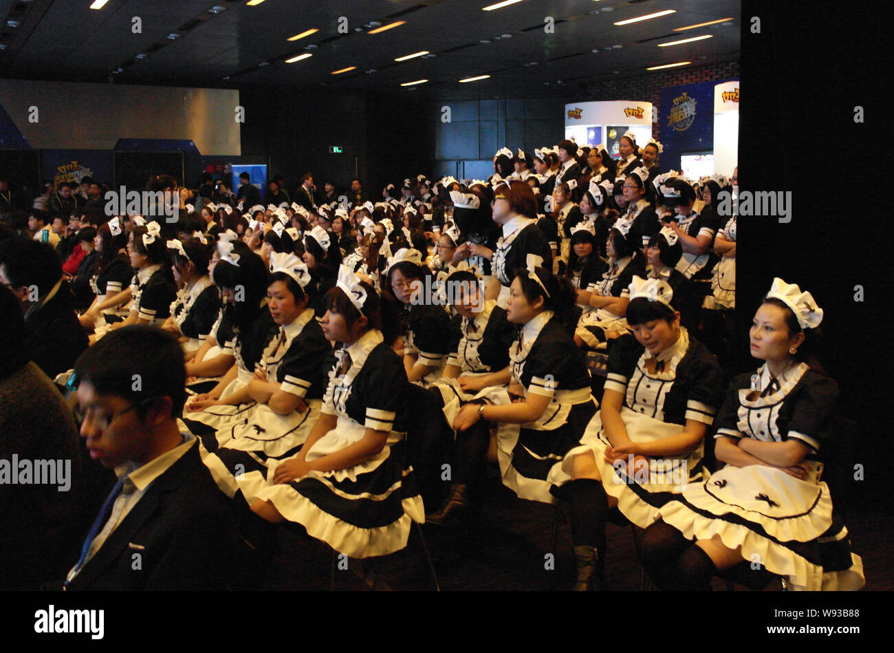 Chinese females dressed up as French maids during an attempt of Guinness record-breaking biggest French maid gathering held by 17173 Game in Shanghai Stock Photo
