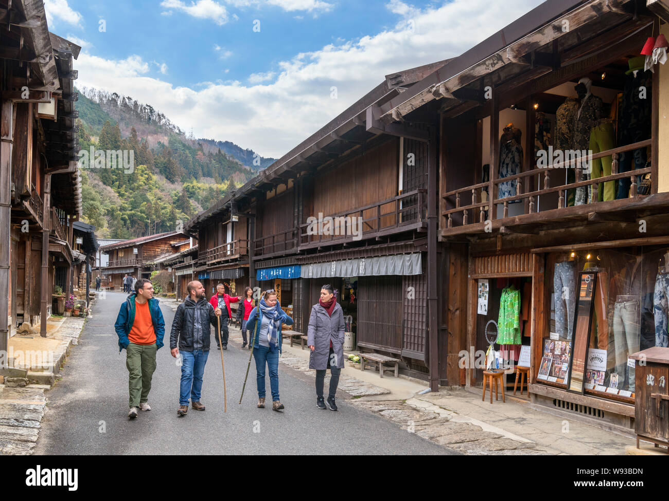 Visitors walking down Main street in the old post town of Tsumago (Tsumago-juku), Nagiso, Kiso District, Nagano Prefecture, Japan Stock Photo