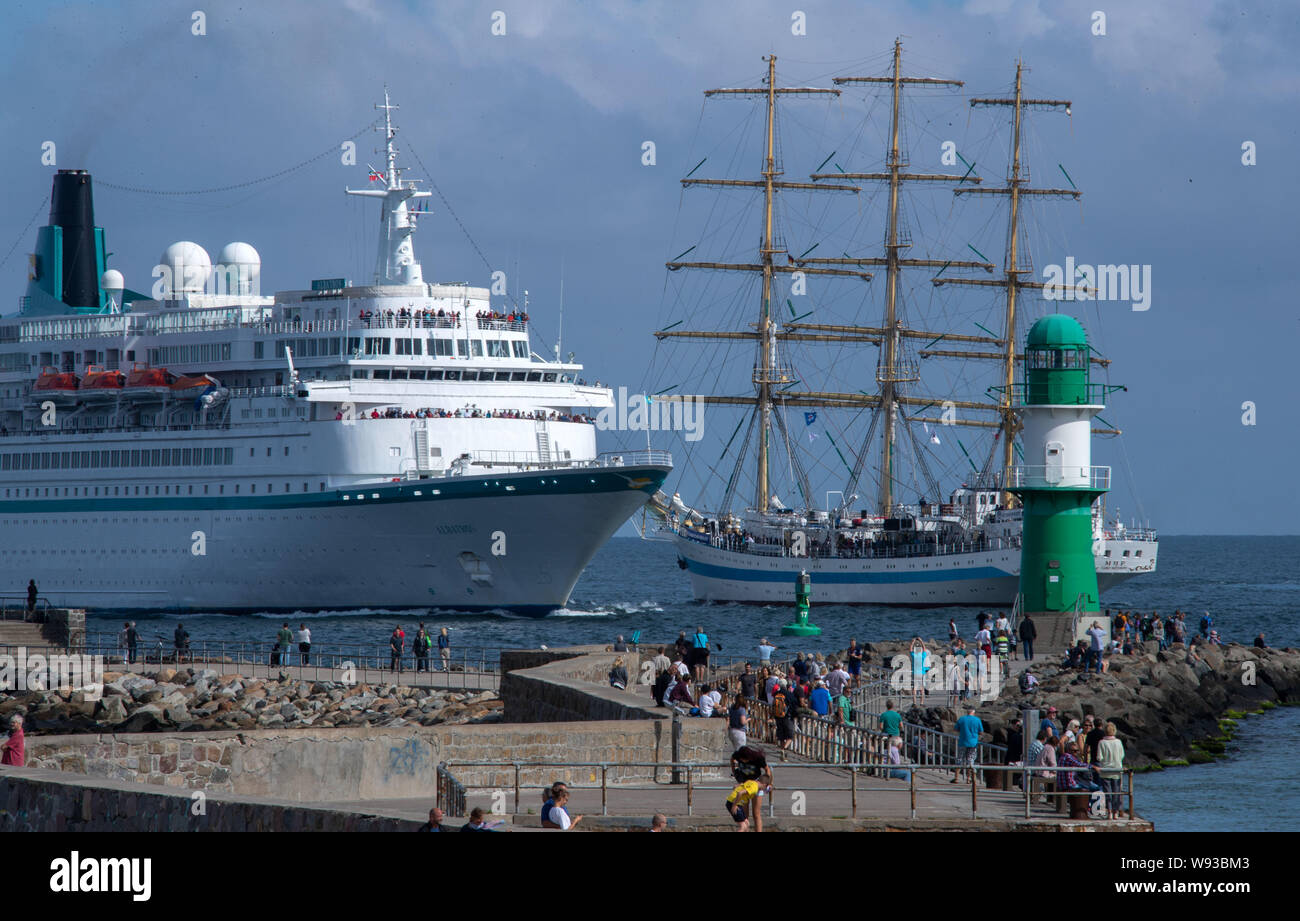 09 August 2019, Mecklenburg-Western Pomerania, Rostock-Warnemünde: The cruise ship 'Albatros' of the shipping company 'Phoenix Kreuzfahrten' enters the port of Rostock through the sea channel. On the second day of the 29th Hanse Sail, traditional and museum ships start their trips on the Baltic Sea. Until 11.08.2019, 170 ships and around one million visitors are expected to attend the four-day maritime fair. Photo: Jens Büttner/dpa-Zentralbild/ZB Stock Photo