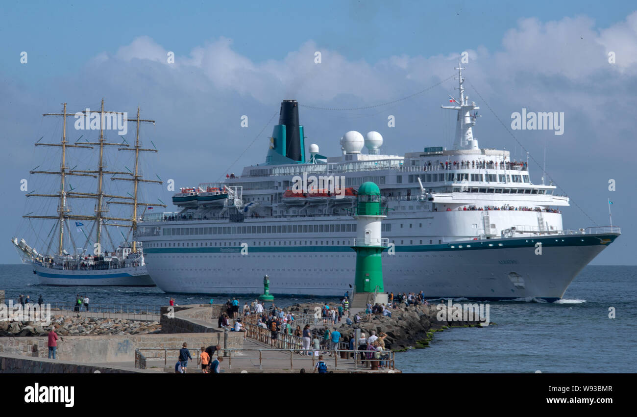 09 August 2019, Mecklenburg-Western Pomerania, Rostock-Warnemünde: The cruise ship 'Albatros' of the shipping company 'Phoenix Kreuzfahrten' enters the port of Rostock through the sea channel. On the second day of the 29th Hanse Sail, traditional and museum ships start their trips on the Baltic Sea. Until 11.08.2019, 170 ships and around one million visitors are expected to attend the four-day maritime fair. Photo: Jens Büttner/dpa-Zentralbild/ZB Stock Photo