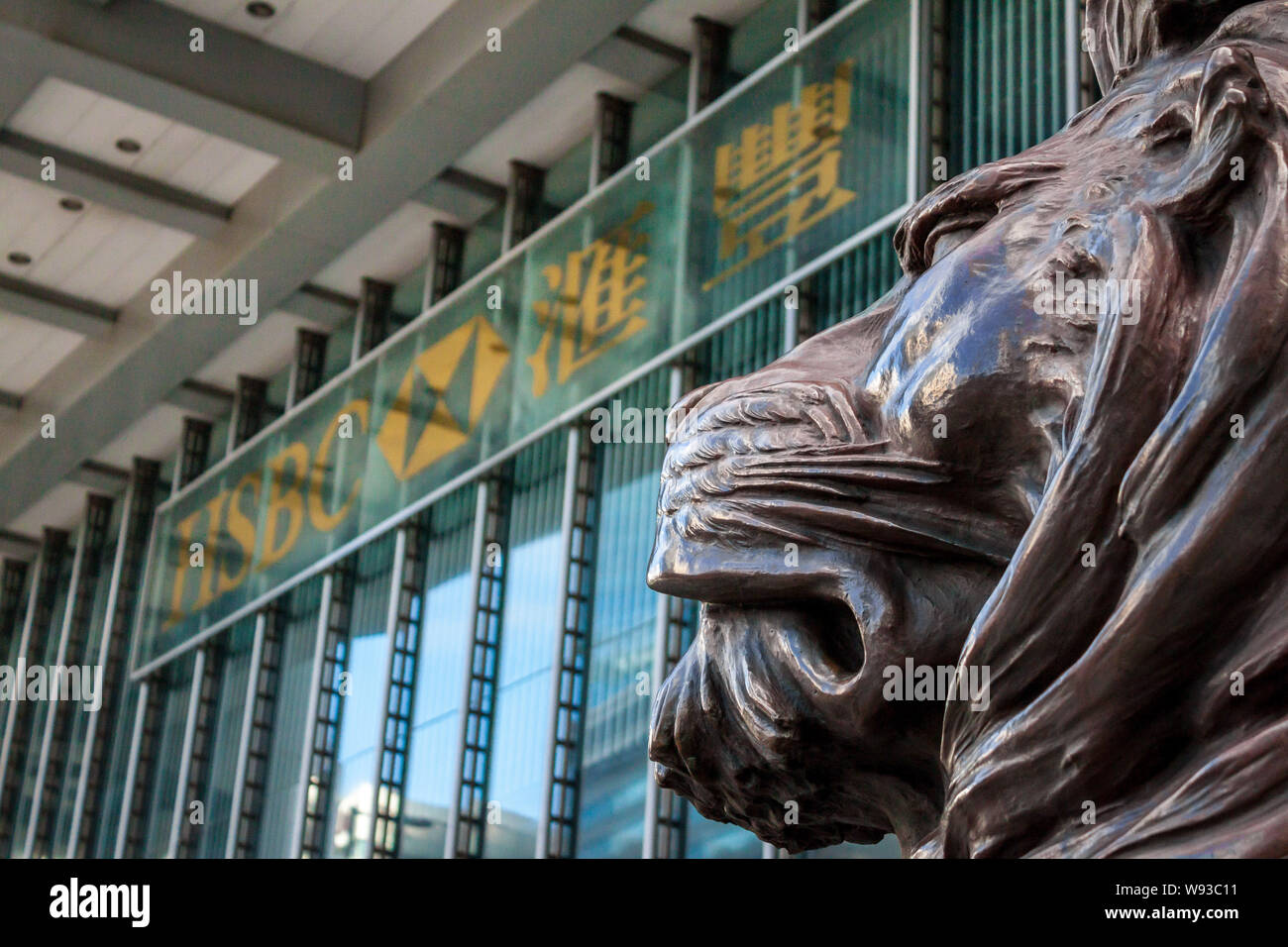 --FILE--A lion statue is displayed in front of the HSBC Tower in Hong Kong, China, 6 July 2012.   The global rate-fixing investigation widened Tuesday Stock Photo