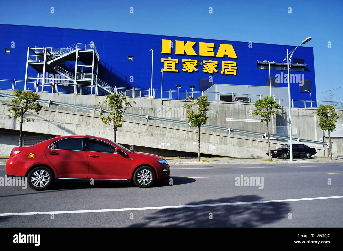 File A Car Passes By A Home Furnishing Store Of Ikea In Pudong