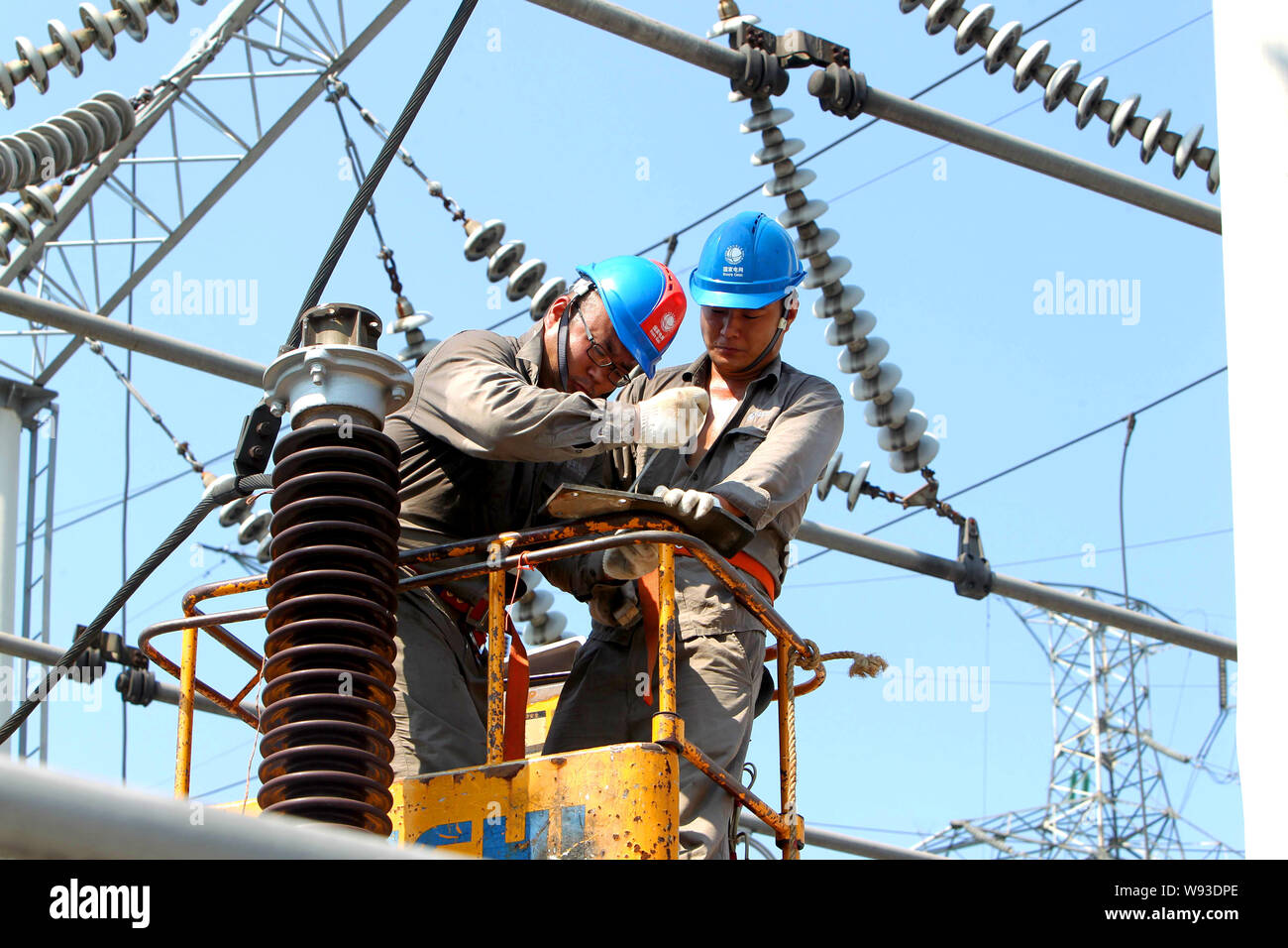 Chinese electricians of the State Grid Corporation of China check and
