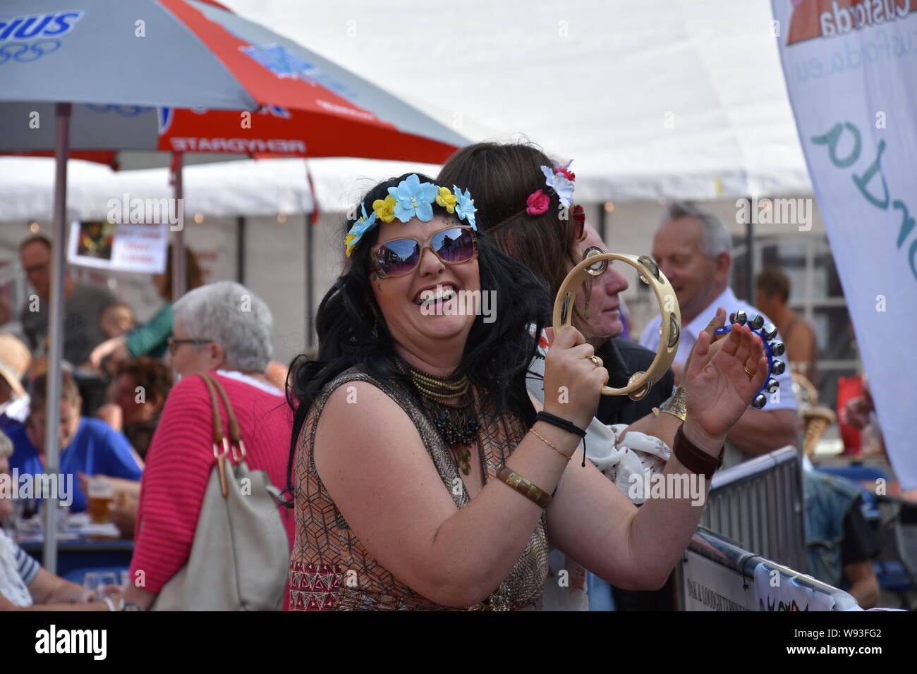 Sint Gillis Waas, Belgium, August 3, 2019, Remember Woodstock festival, love, peace and understanding. Beautiful girl with a beautiful smile played th Stock Photo