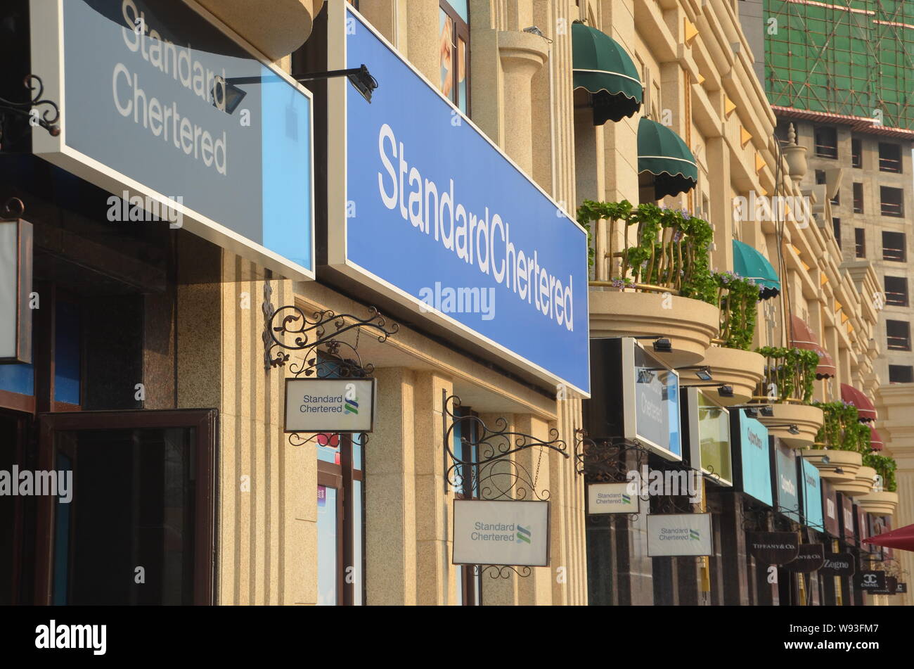 View of signboards reading Standard Chertered instead of Standard Chartered on a fake luxury shopping strip in Shenyang, northeast Chinas Liaoning pro Stock Photo
