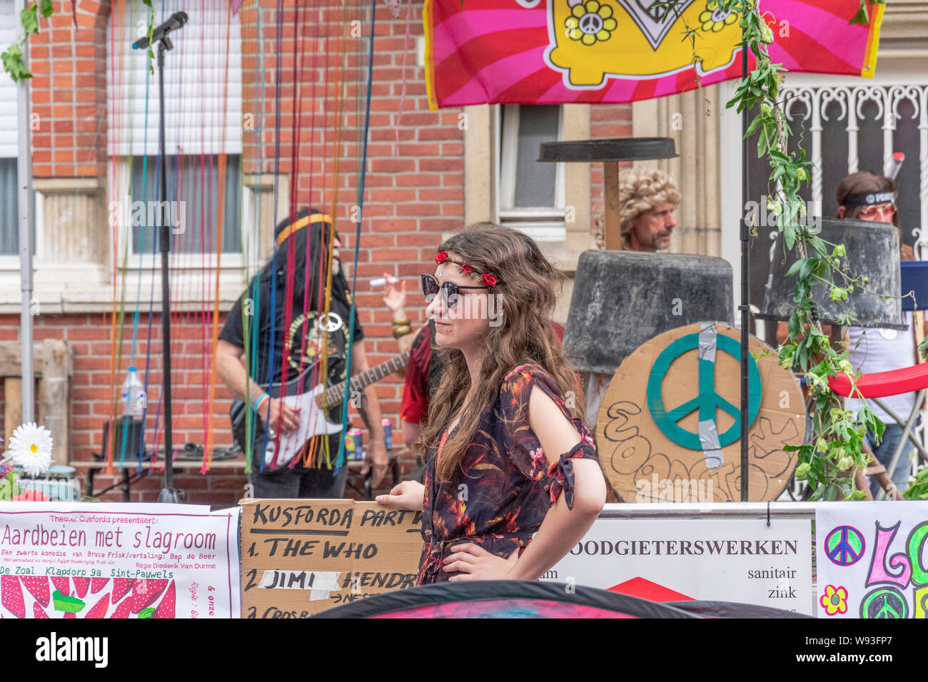 Sint Gillis Waas, Belgium, August 3, 2019, Remember Woodstock festival, love, peace and understanding. Teenage girl has flowers in her hair Stock Photo