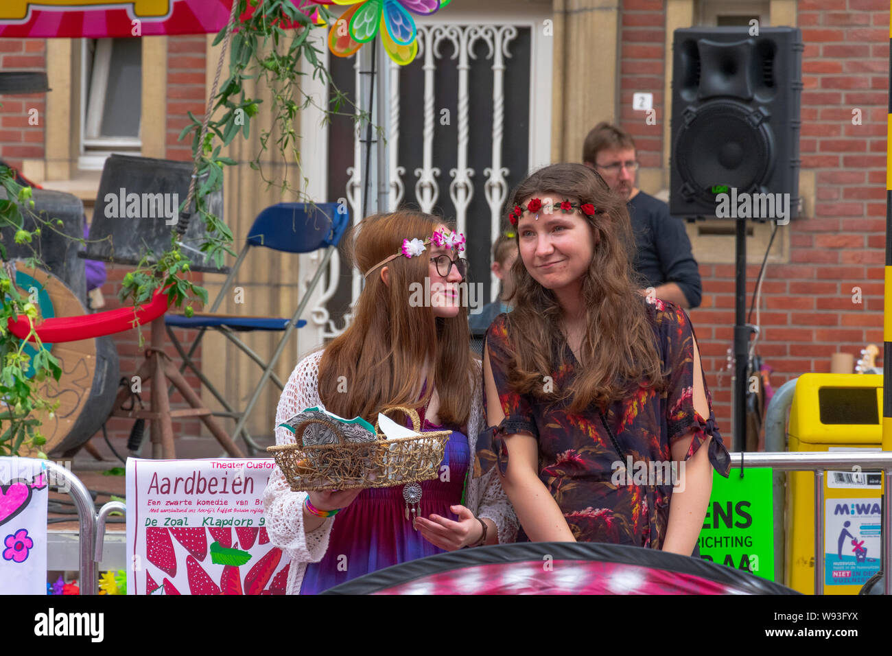 Sint Gillis Waas, Belgium, August 3, 2019, Remember Woodstock festival, love, peace and understanding. Two teenage girls love the music of the 70s Stock Photo