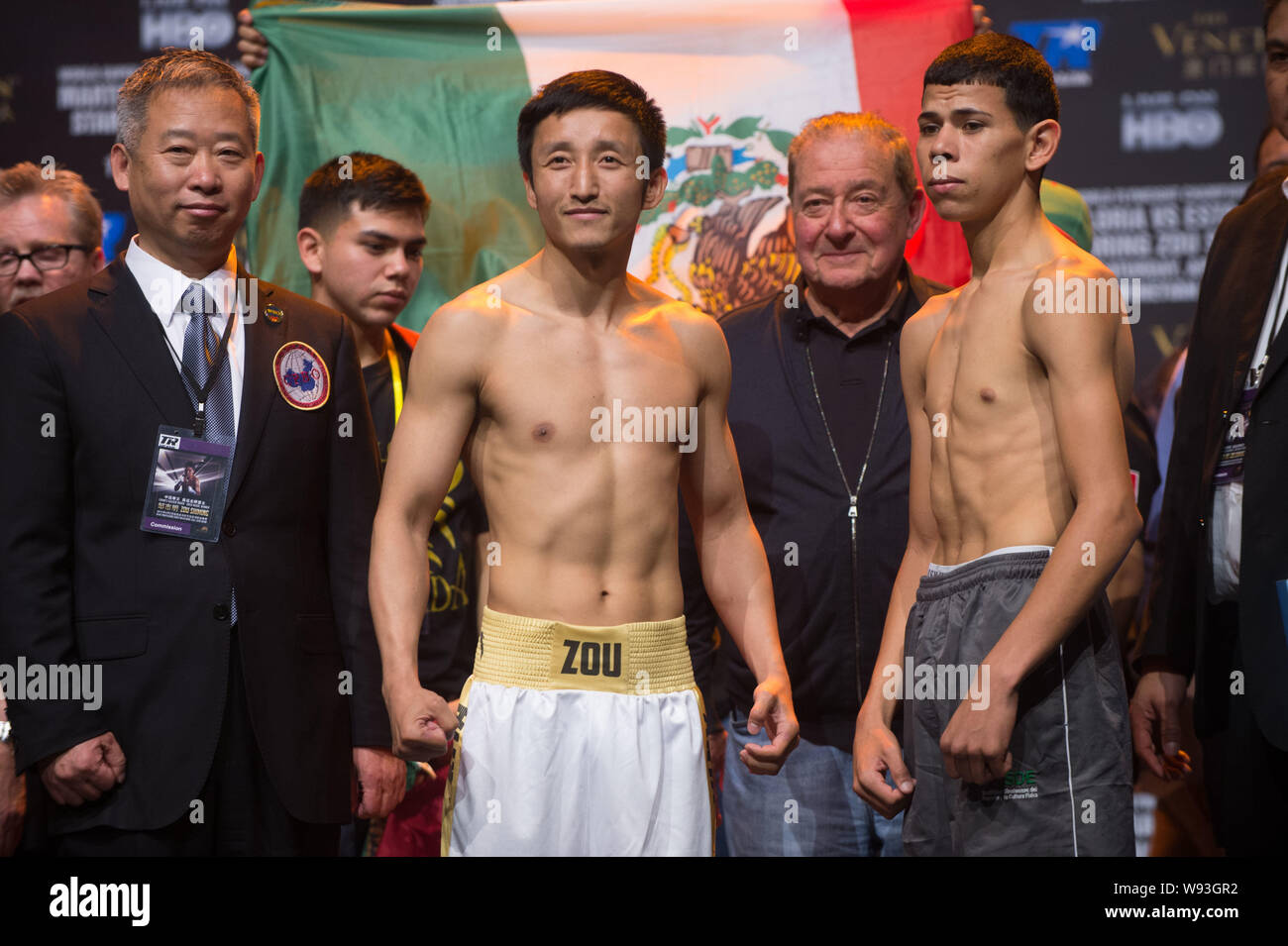 Chinese Olympic boxing champion Zou Shiming (front center) poses during