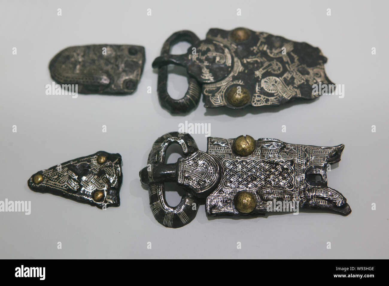 Merovingian iron and silver damascened harness parts dated from the 7th century AD found in Colmar on display in the Unterlinden Museum (Musée Unterlinden) in Colmar, Alsace, France. Stock Photo