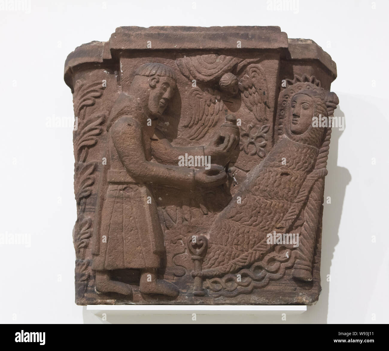 Last Communion of Saint Mary of Egypt. Romanesque capital dated from around 1150 from the Alspach Abbey (Abbaye d'Alspach), now on display in the Unterlinden Museum (Musée Unterlinden) in Colmar, Alsace, France. Stock Photo