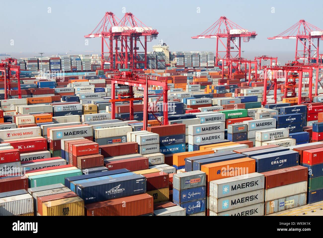 Piles of containers are pictured at a terminal of Yangshan Deep-water Port in Shanghai, China, 10 September 2013.   Shanghai is pulling away as the cl Stock Photo