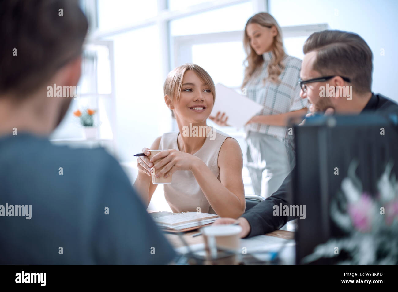 young business woman sitting at office Desk Stock Photo - Alamy