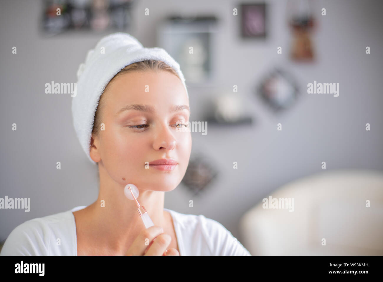 Face Massage Beautiful Woman Is Getting Massage Face Using Jade Facial Roller For Skin Care