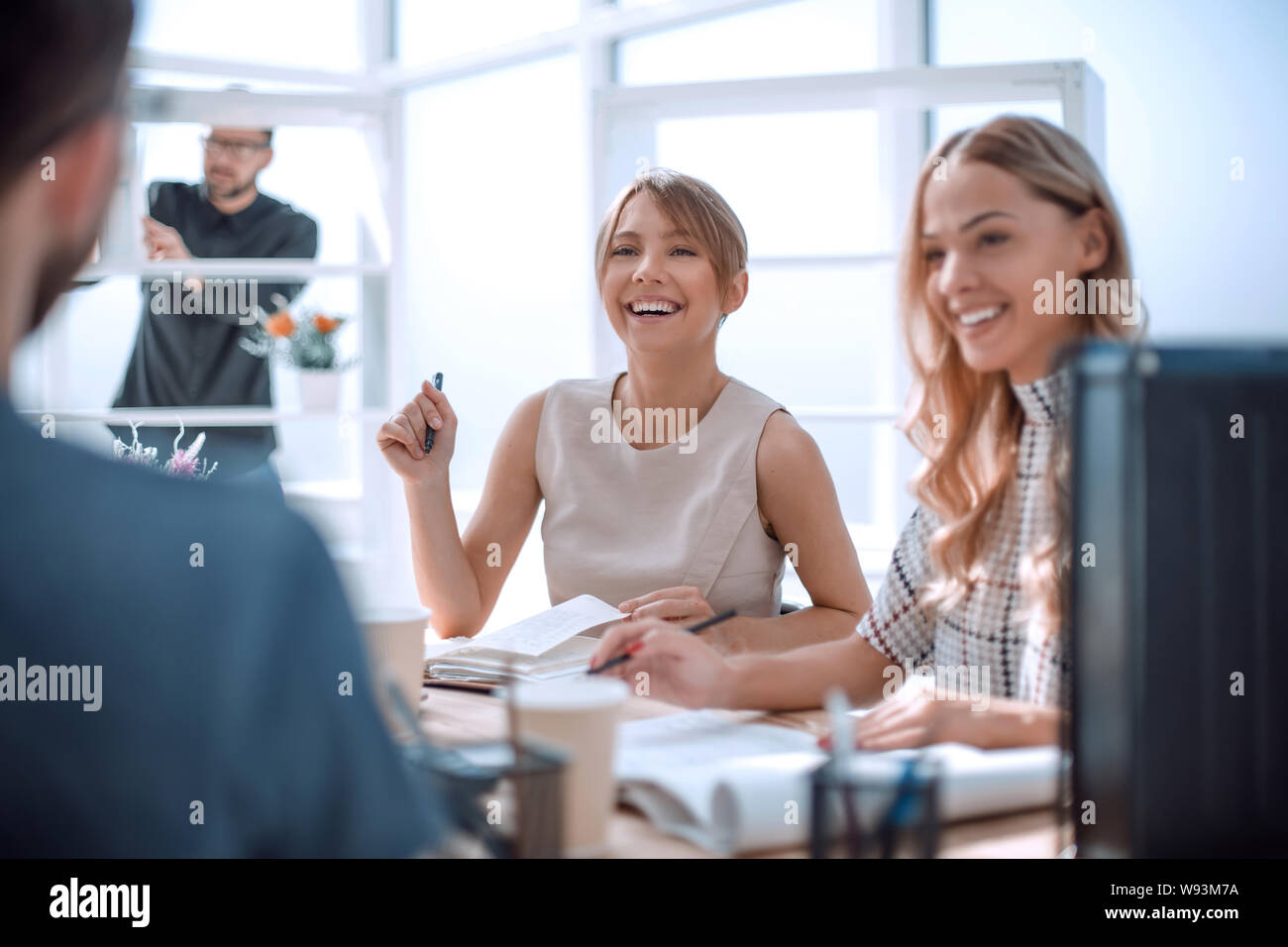 young business woman sitting at office Desk Stock Photo - Alamy