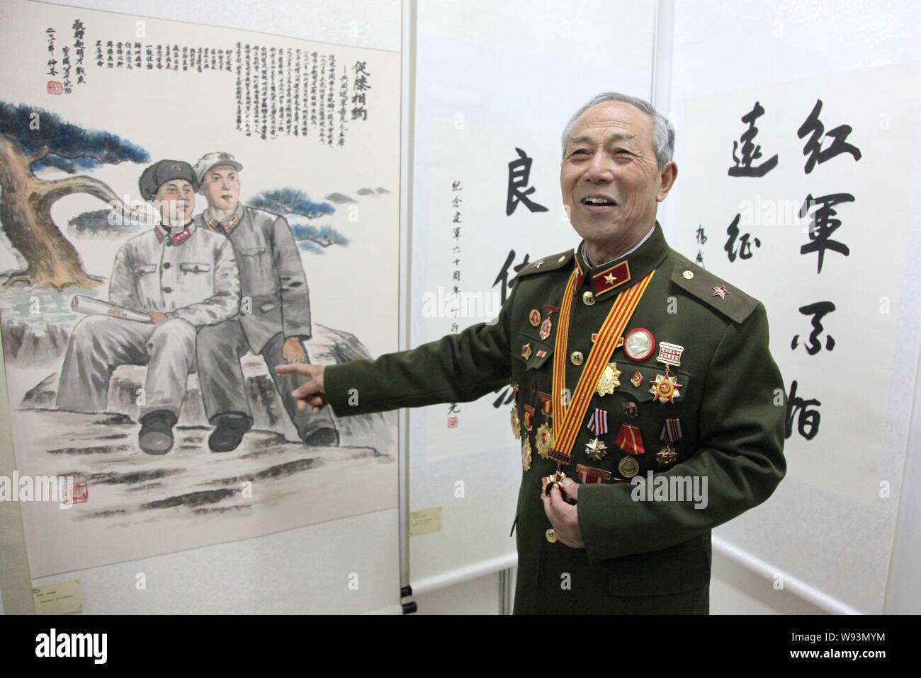 --FILE--Zhao Mingcai, a contemporary comrade of Lei Feng, the nations most famous Good Samaritan, shows his collections during an exhibition in Nanjin Stock Photo