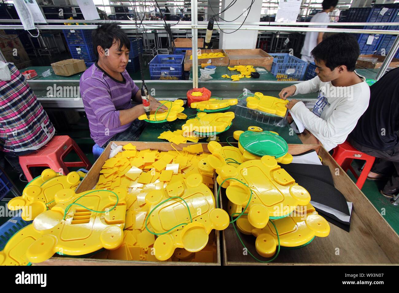 FILEChinese workers assemble electric toy turtles on the production