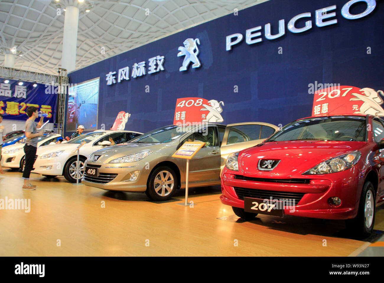 --FILE--Cars are displayed at the stand of Peugeot during the 6th Hainan automobile expo in Haikou city, south Chinas Hainan province, 8 September 201 Stock Photo