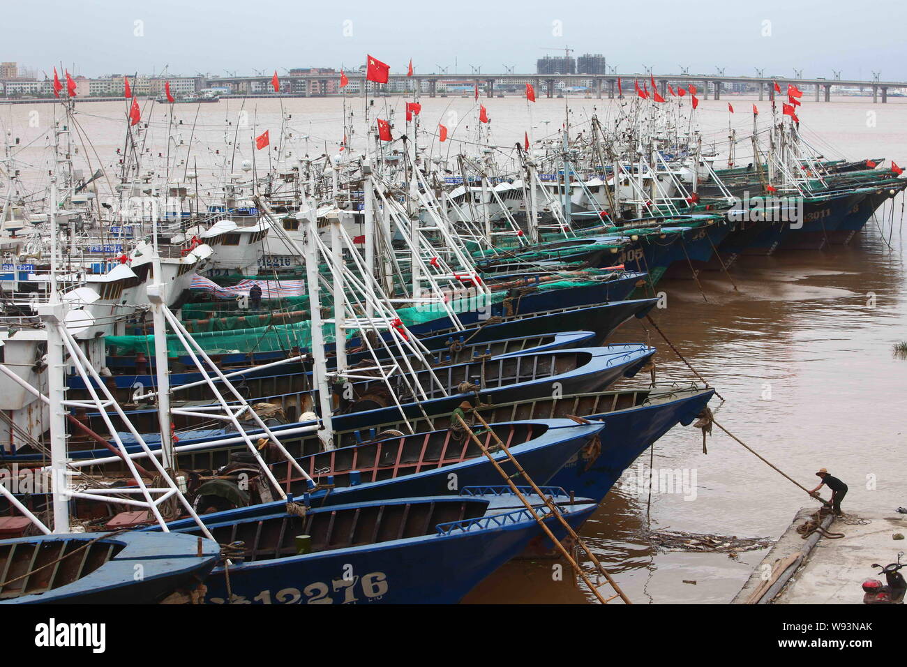 Fishing boats are docked at a harbor as Typhoon Trami approaches in Ruian city, east Chinas Zhejiang province, 21 August 2013.   China braced itself f Stock Photo