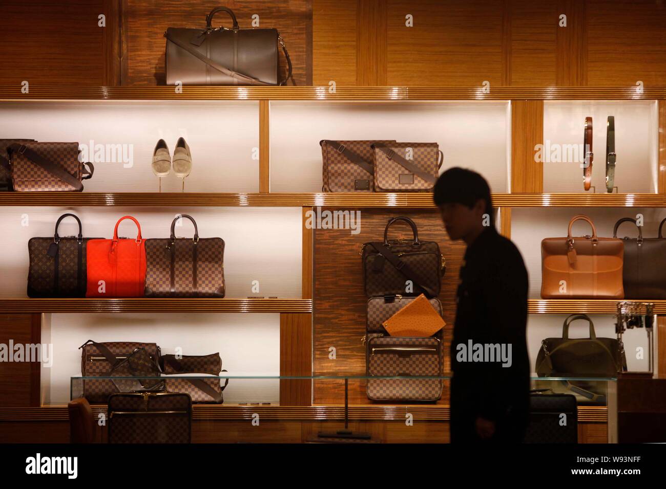 FILE--A Chinese employee looks on in a Louis Vuitton (LV) store in