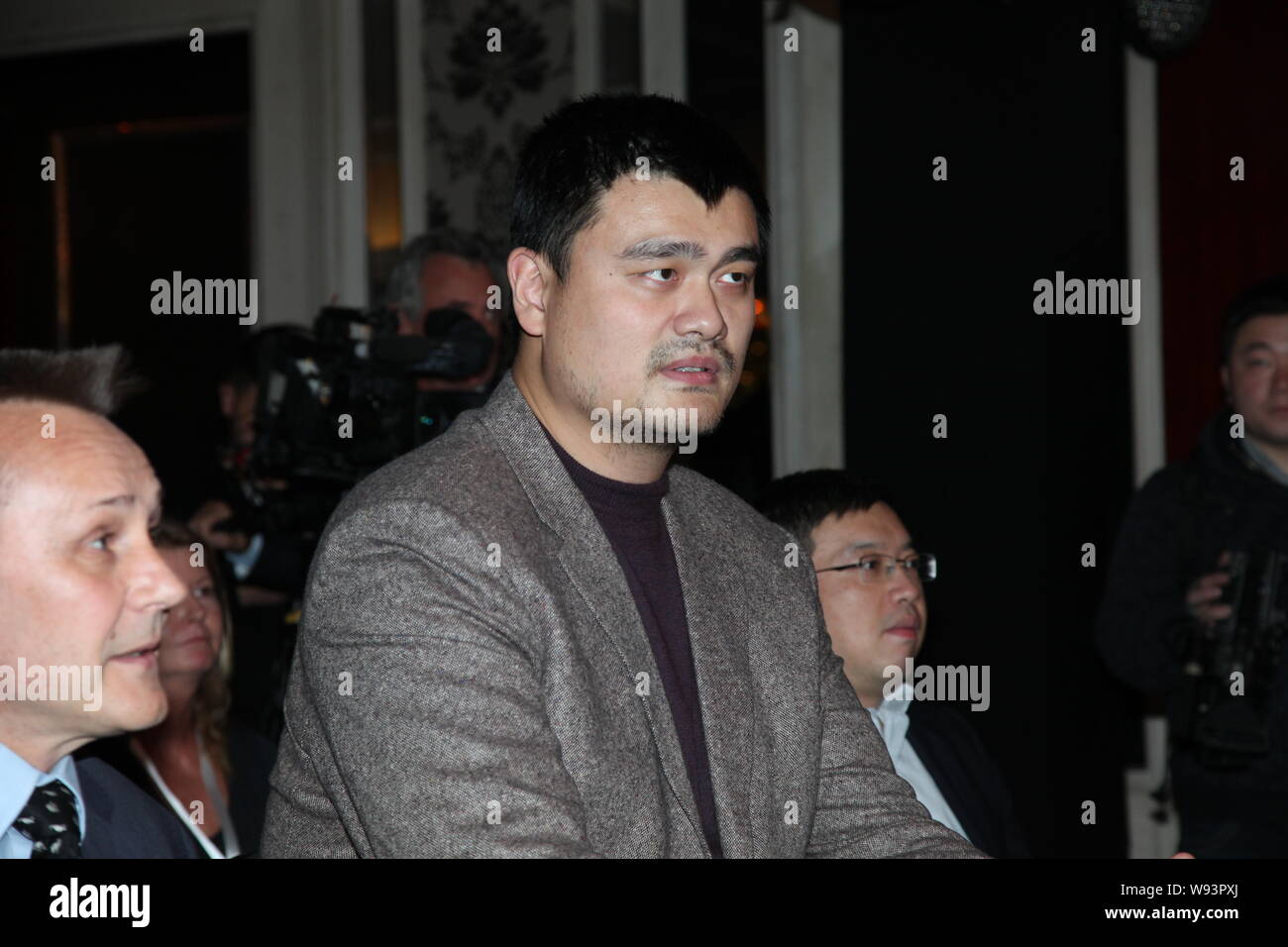 Former NBA basketball player Yao Ming, center, is pictured during a press conference for the global release of a noncommercial film aiming to protect Stock Photo