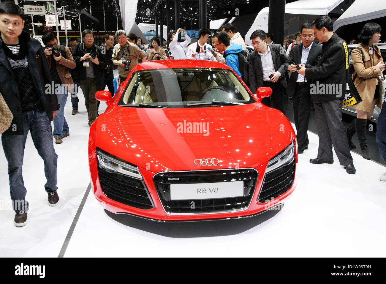 --FILE--Visitors look at an imported Audi R8 sports car during the 15th Shanghai International Automobile Industry Exhibition, known as Auto Shanghai Stock Photo
