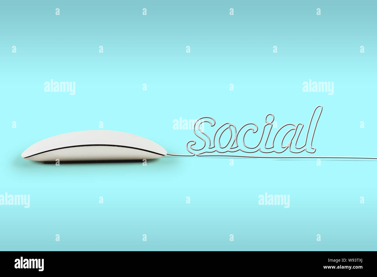 Computer mouse with its wire making a word social Stock Photo