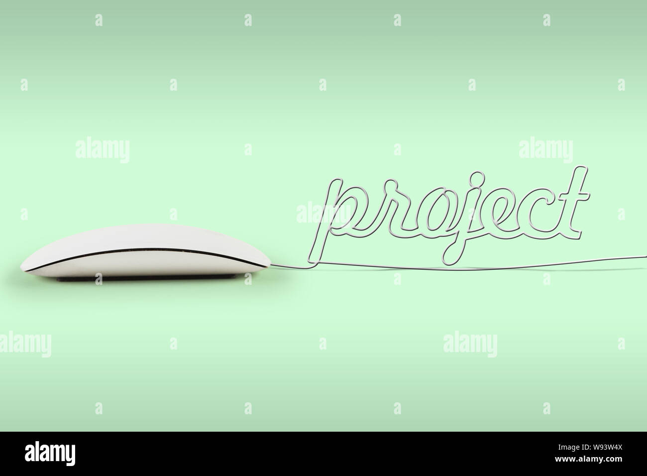 Computer mouse with its wire making a word project Stock Photo - Alamy