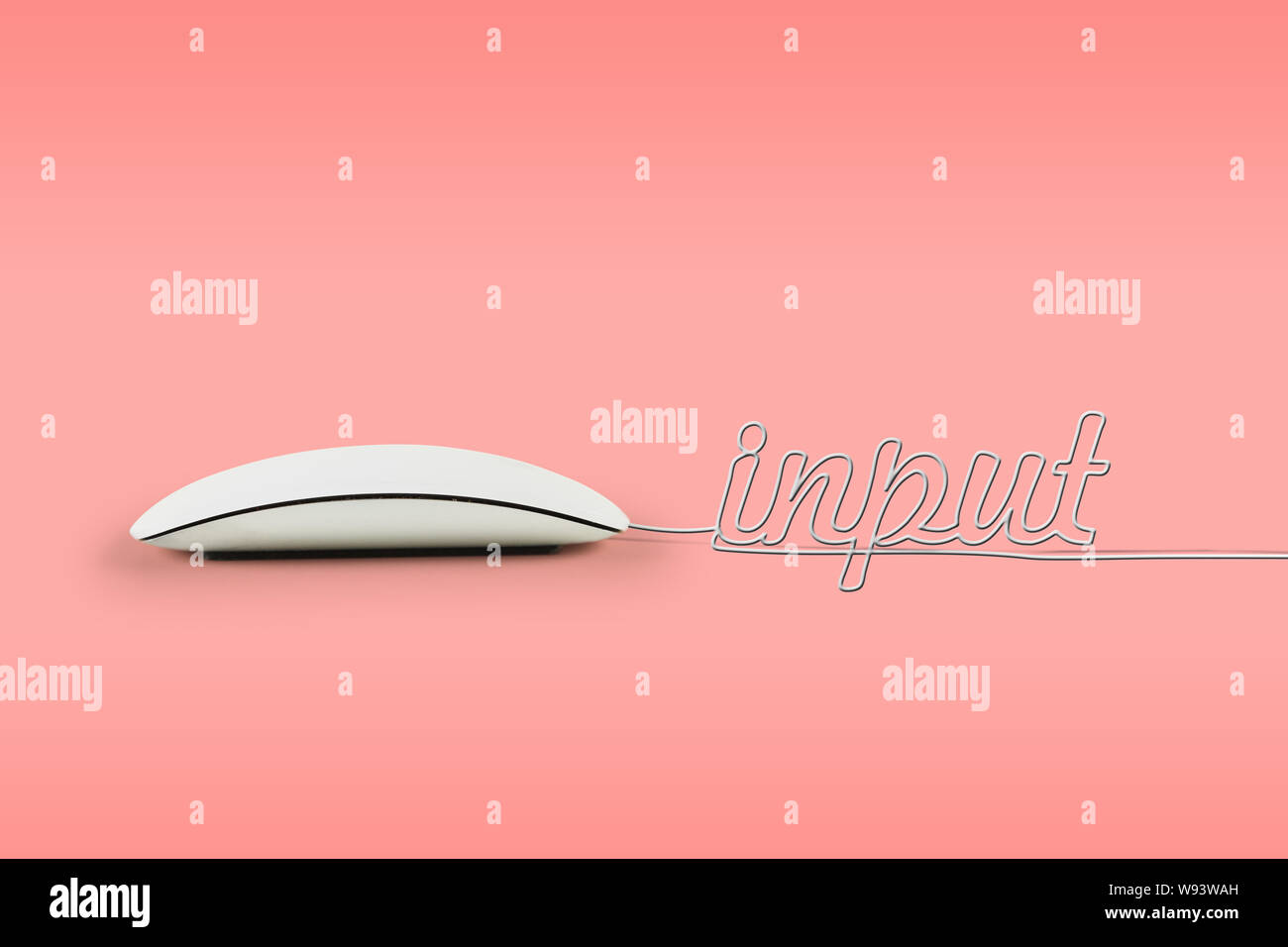 Computer mouse with its wire making a word input Stock Photo