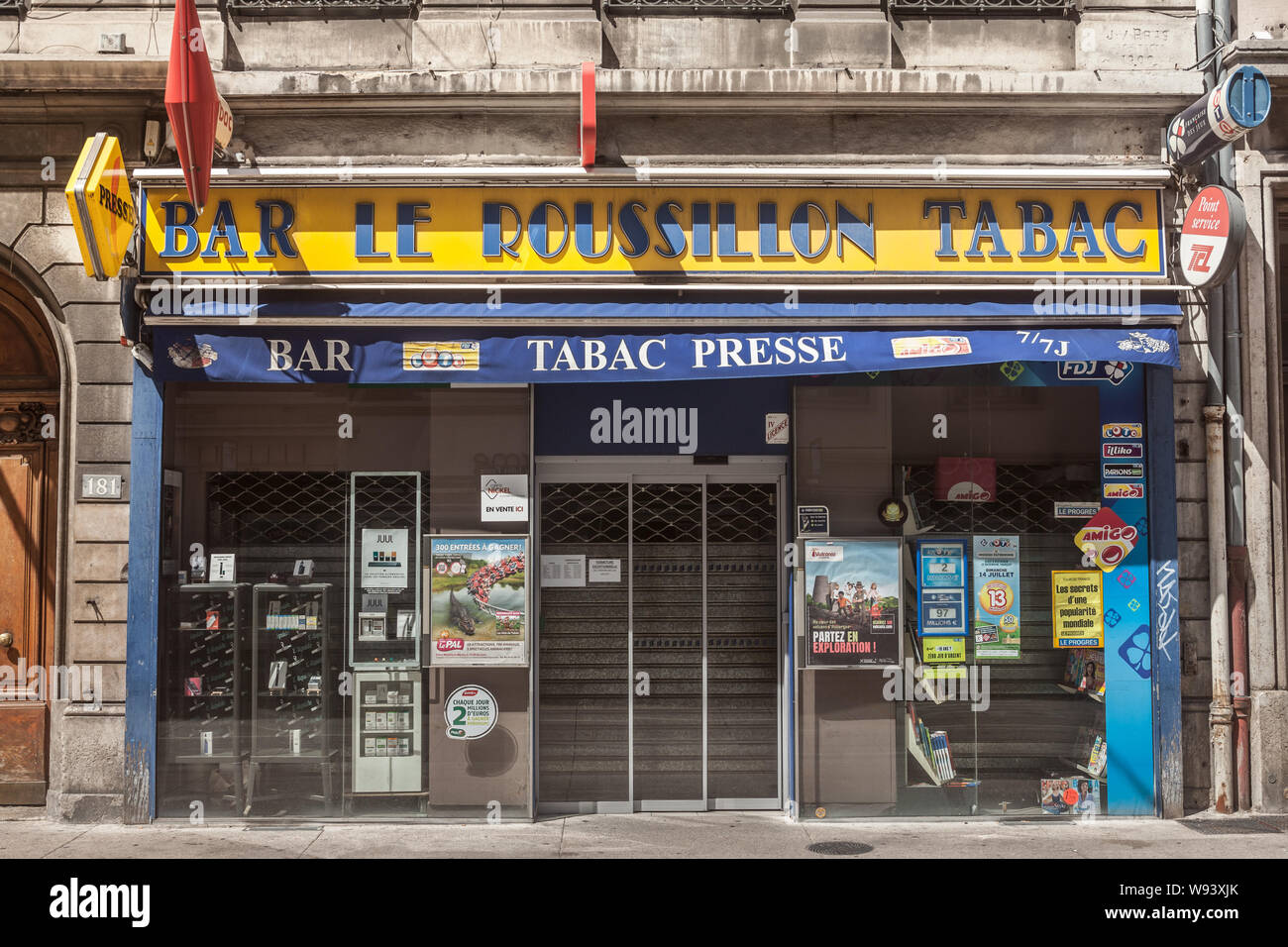 LYON, FRANCE - JULY 14, 2019: Storefront of a French tobacconist shop in Lyon. Also called marchand de tabac or buraliste, they have the monopoly of t Stock Photo