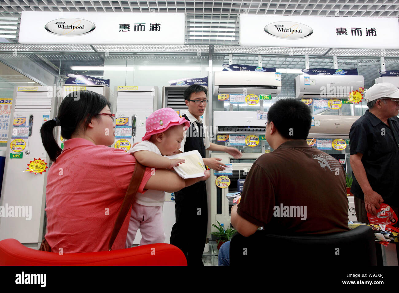 --FILE--Chinese customers shop for Whirlpool air conditioners at a home appliances store in Beijing, China, 22 May 2010.   U.S. appliance maker Whirlp Stock Photo