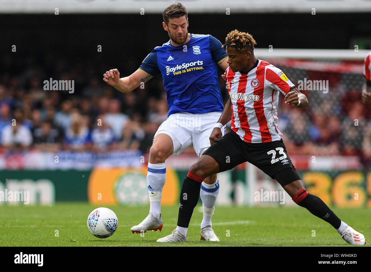 3rd August 2019 , Griffin Park, London, England; Sky Bet Championship, Brentford vs Birmingham City  ; Julian Jeanvier (23) of Brentford takes on a player Credit: Phil Westlake/News Images, Stock Photo