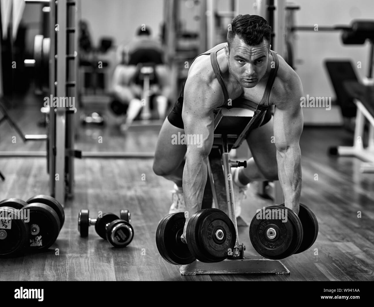 Man doing dumbbell row workout for back muscles Stock Photo Alamy