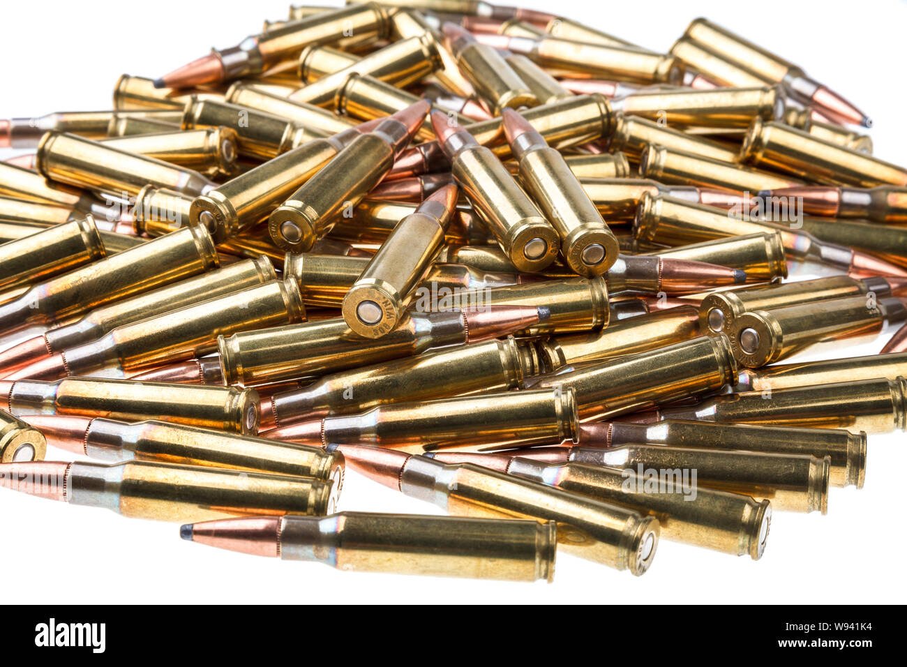 cartridges for 308 caliber rifle on a white background. a bunch of ammo ...