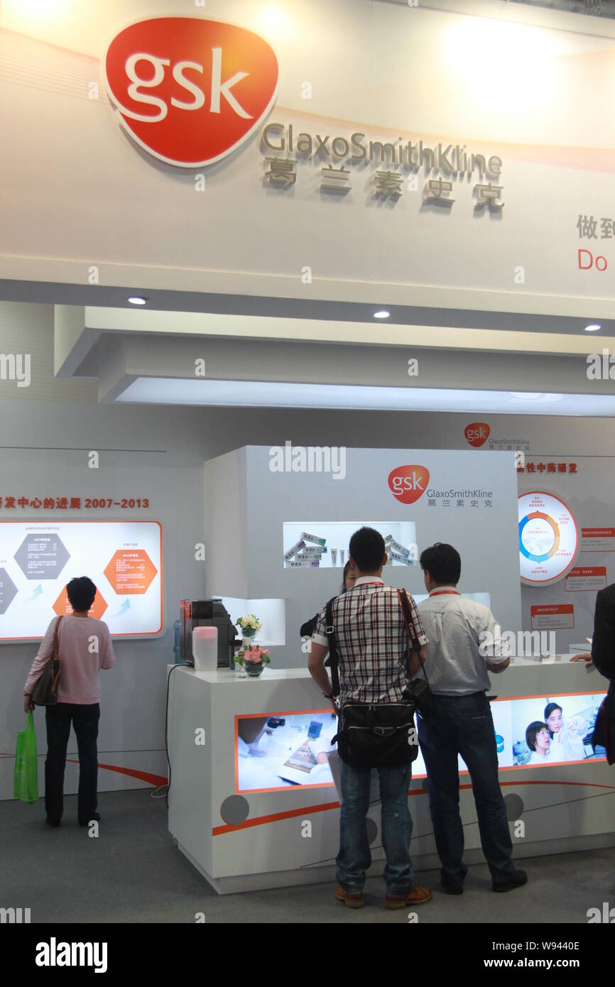 --FILE--People visit the stand of GlaxoSmithKline (GSK) during an exhibition in Shanghai, China, 11 May 2013.    GlaxoSmithKline, the British drug com Stock Photo