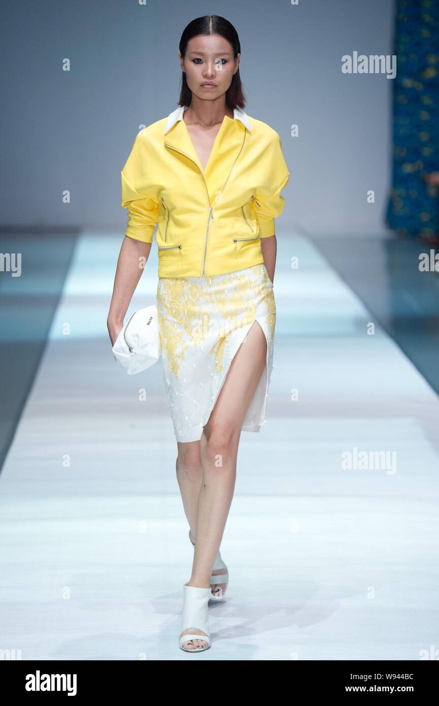 A model displays a new creation by designer Wang Peiyi, at the Wang ...