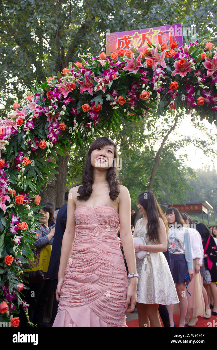 Young Chinese students from Beijing 101 Middle School attend a coming-of-age ceremony at Yuanmingyuan, also known as the Old Summer Palace, in Beijing Stock Photo