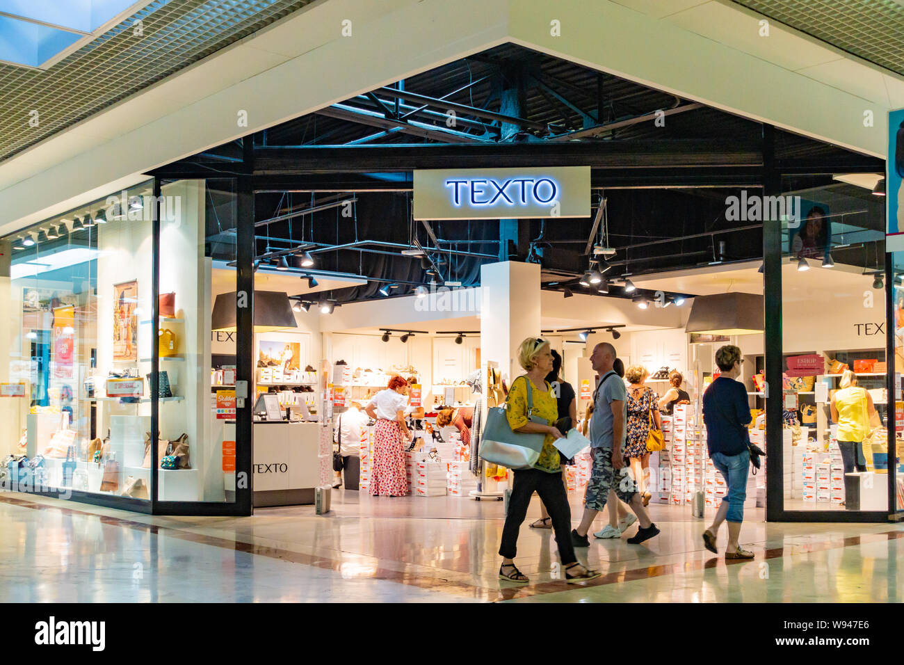 Customers walking and looking at shops in a French shopping Mall Stock  Photo - Alamy