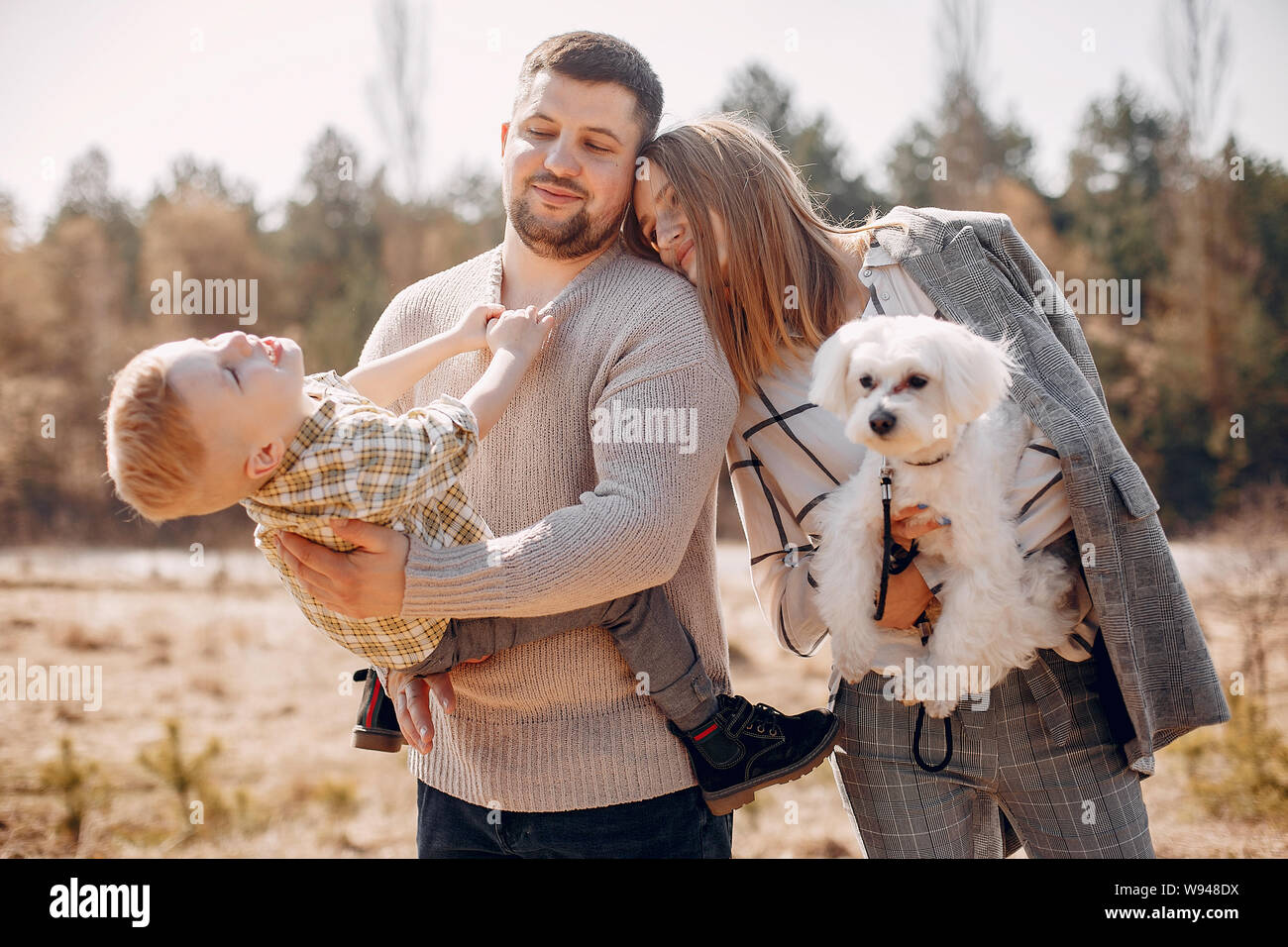 Cute family playing in a spring park Stock Photo