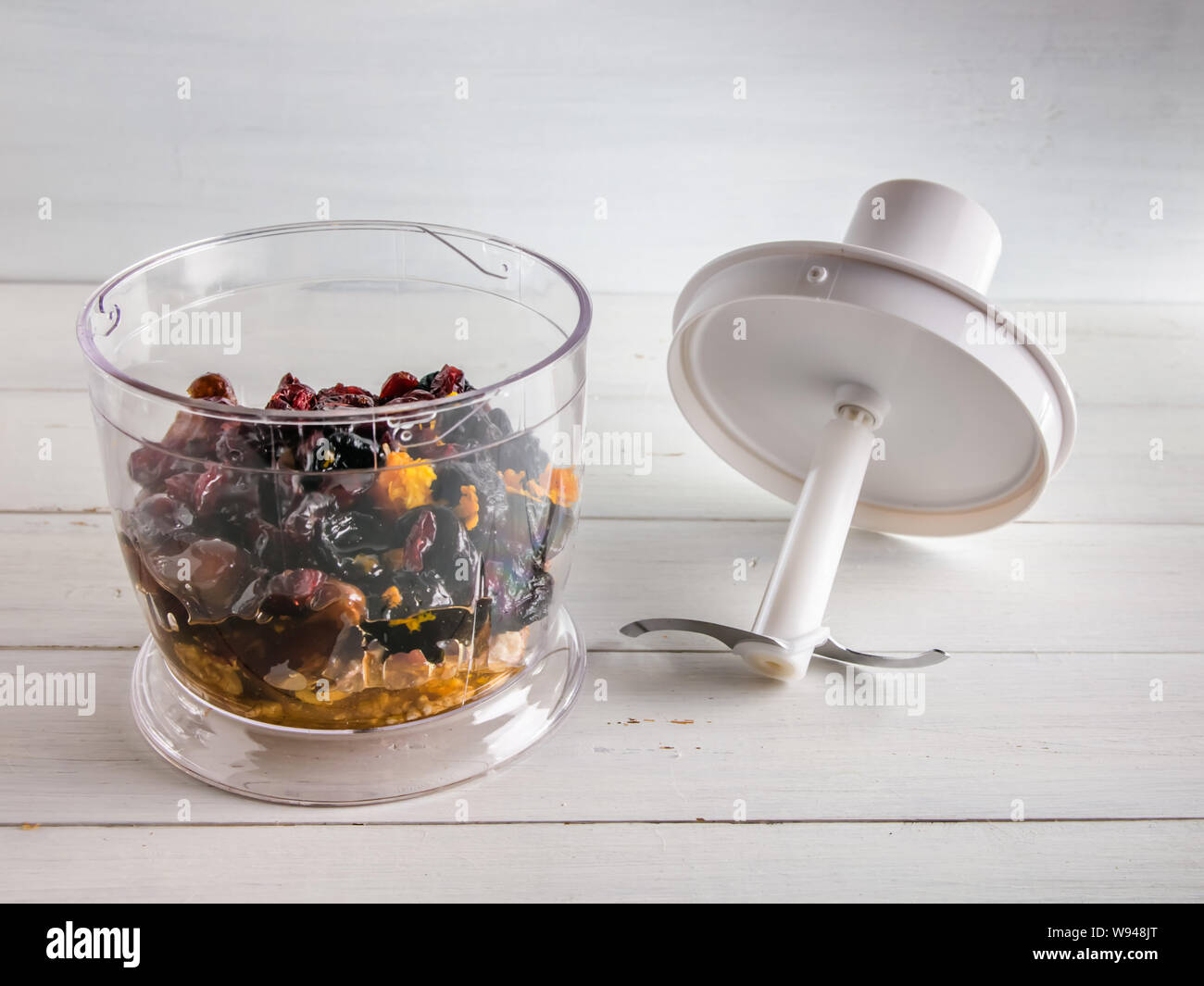 ingredients for energy balls in a blender on white background Stock
