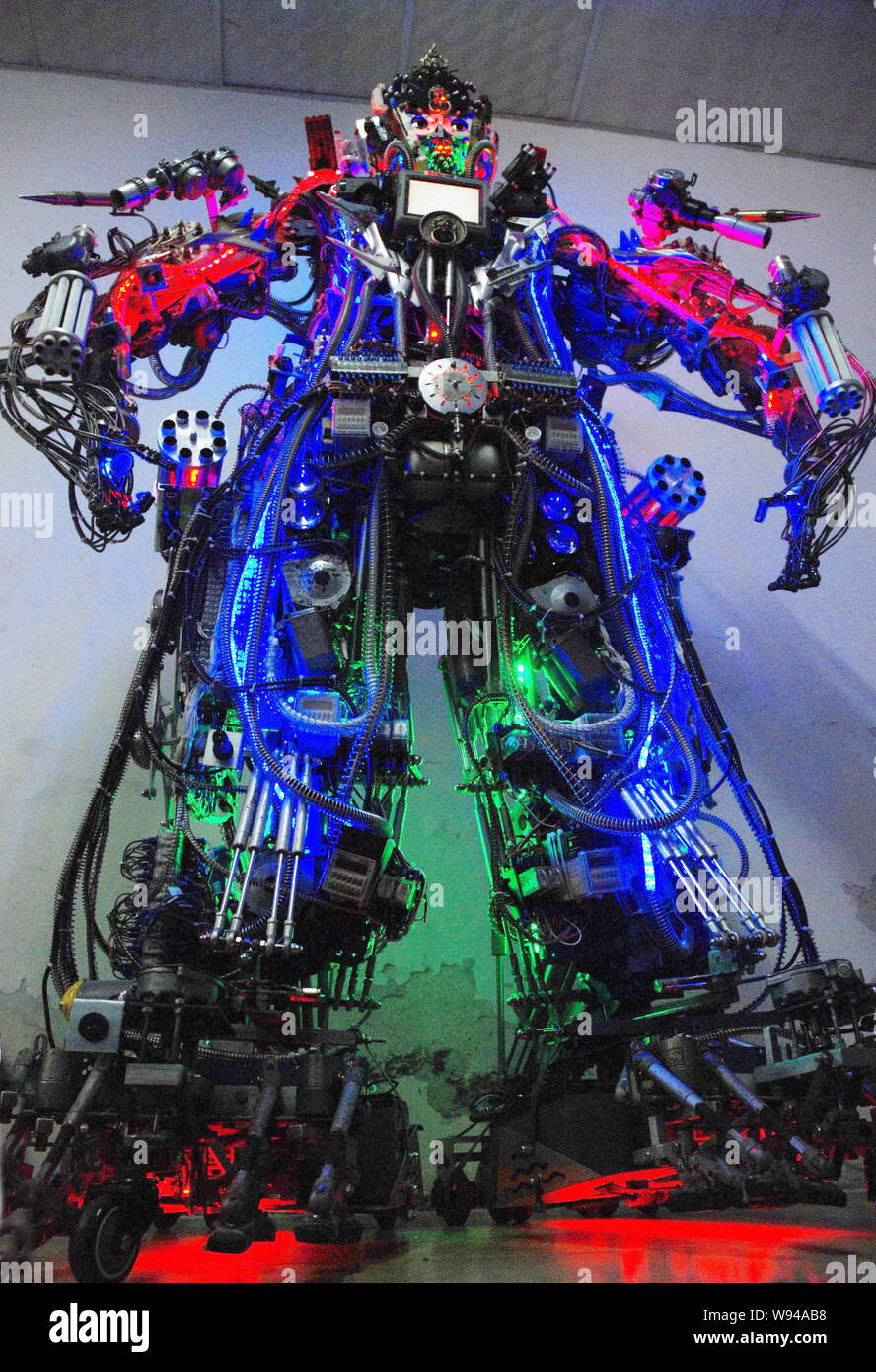 The robot made from scrap by Chinese farmer Tao Xiangli is displayed at his home in Beijing, China, 16 May 2013.   Tao Xiangli, a 37-year-old inventor Stock Photo