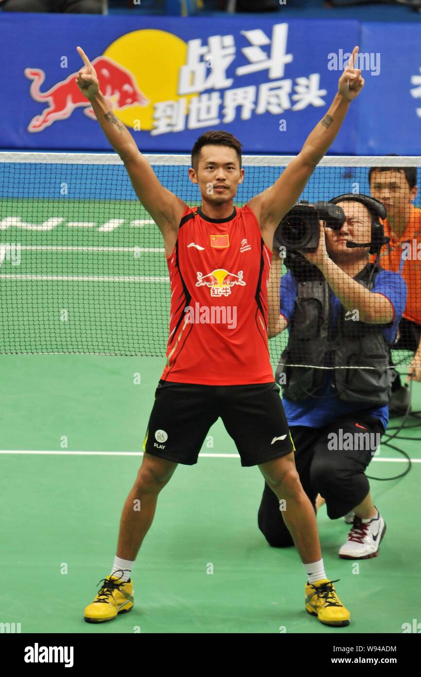 Chinese badminton player Lin Dan poses after he wins the championship for the Mens Singles tournament of the 2013 BWF World Championships in Guangzhou Stock Photo