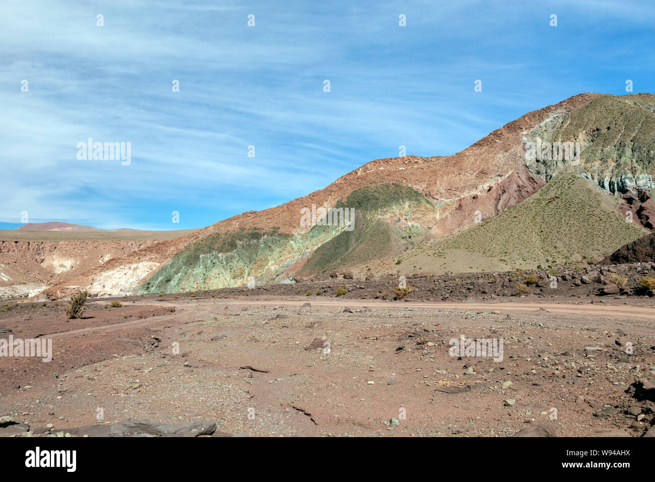 Rainbow Valley or Valle de Arcoiris in San Pedro de Atacama that stands out for the color of its reddish, beige, green and white earth Stock Photo