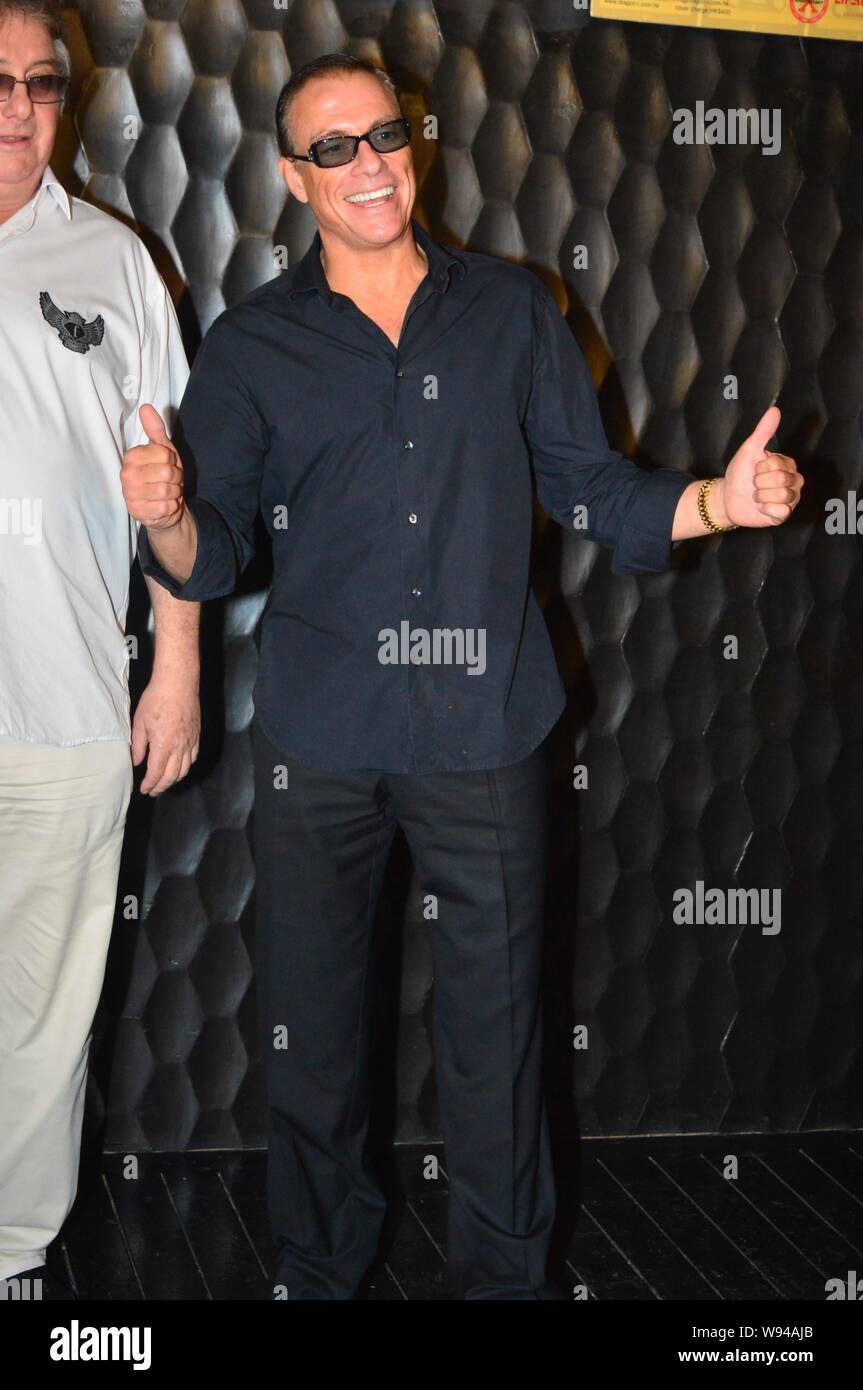 Hollywood action star Jean-Claude Van Damme, right, poses during a press  conference for his upcoming new film in Hong Kong, China, 19 June 2013  Stock Photo - Alamy