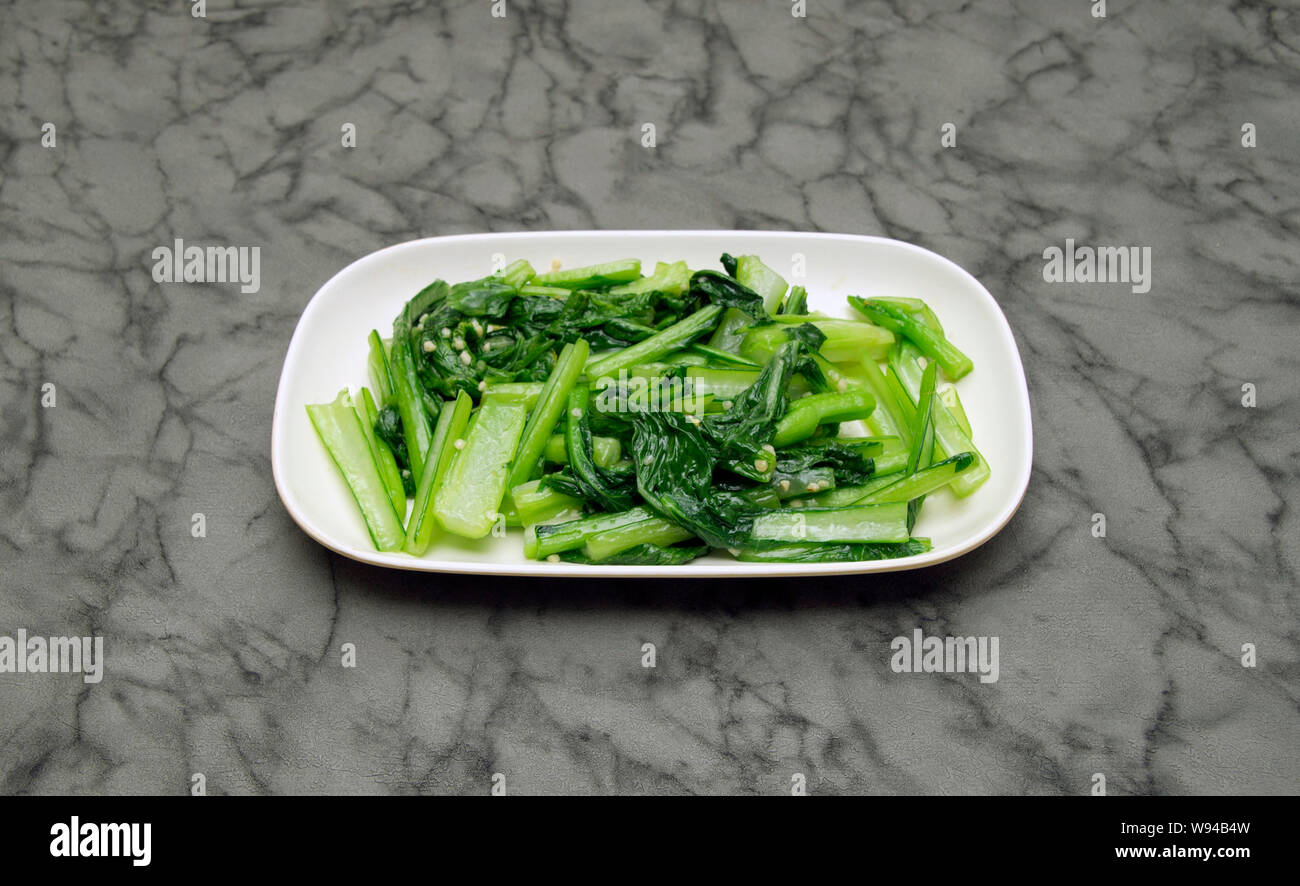 Chinese food.  Choi sum with garlic sauce Stock Photo