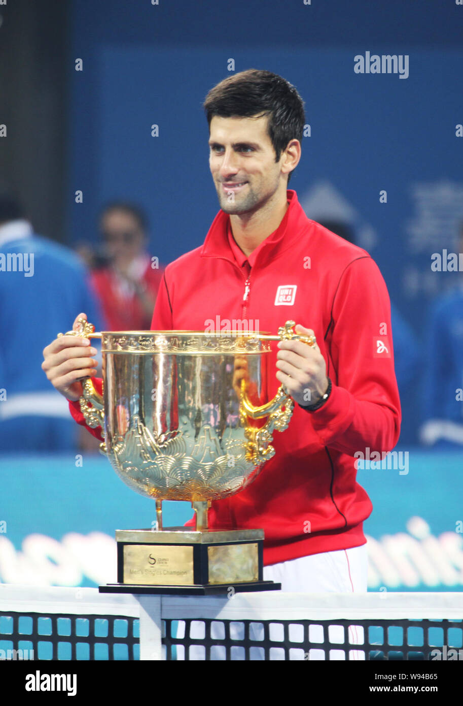 Novak Djokovic of Serbia holds up his trophy after the final of the