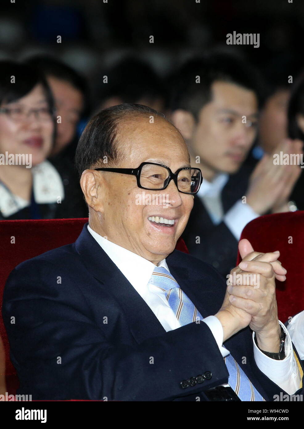 --FILE--Li Ka-shing, Chairman of Cheung Kong (Holdings) Limited and Chairman of Hutchison Whampoa Limited, applauds during an event in Beijing, China, Stock Photo