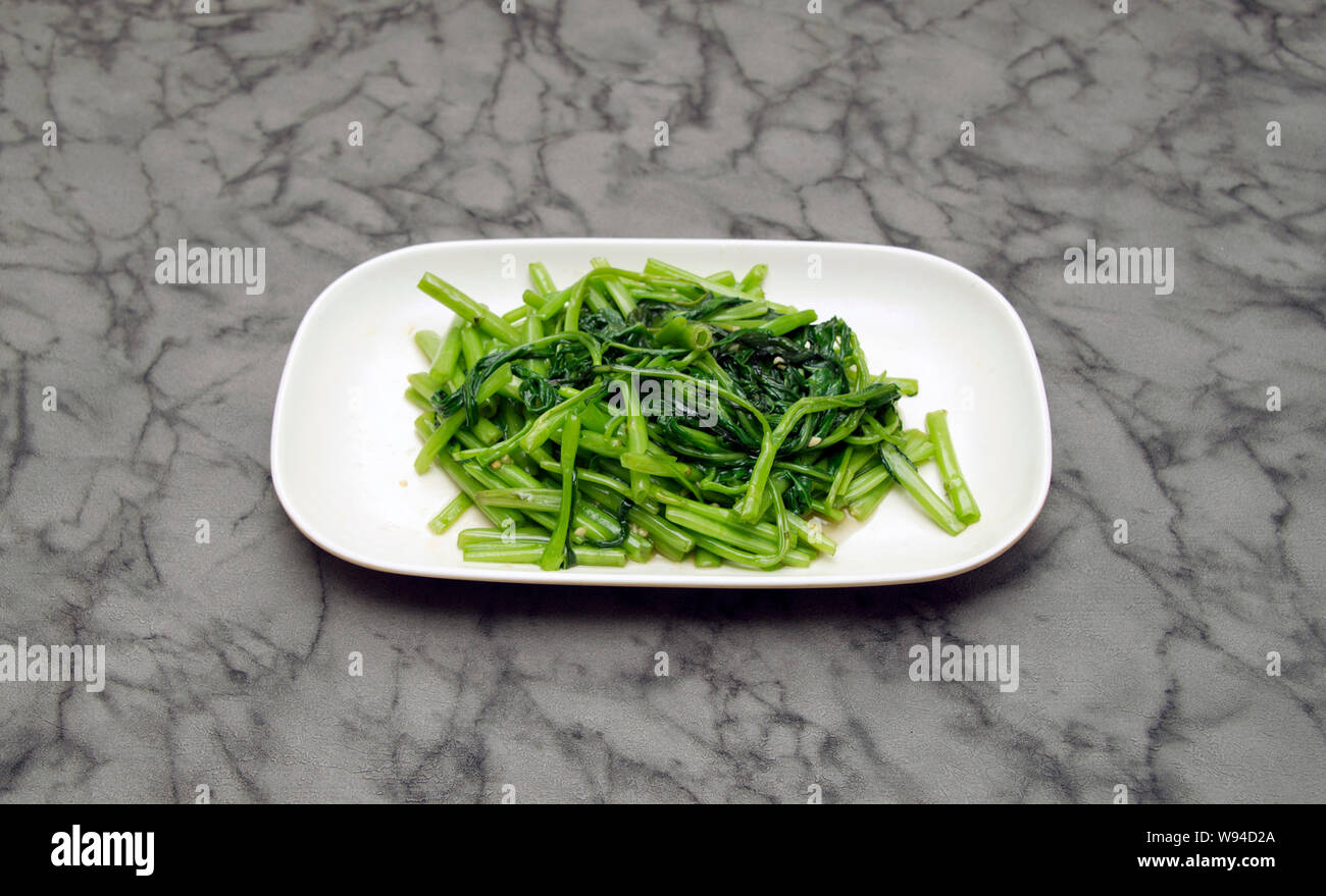 Chinese food. Morning glory with garlic sauce Stock Photo Alamy